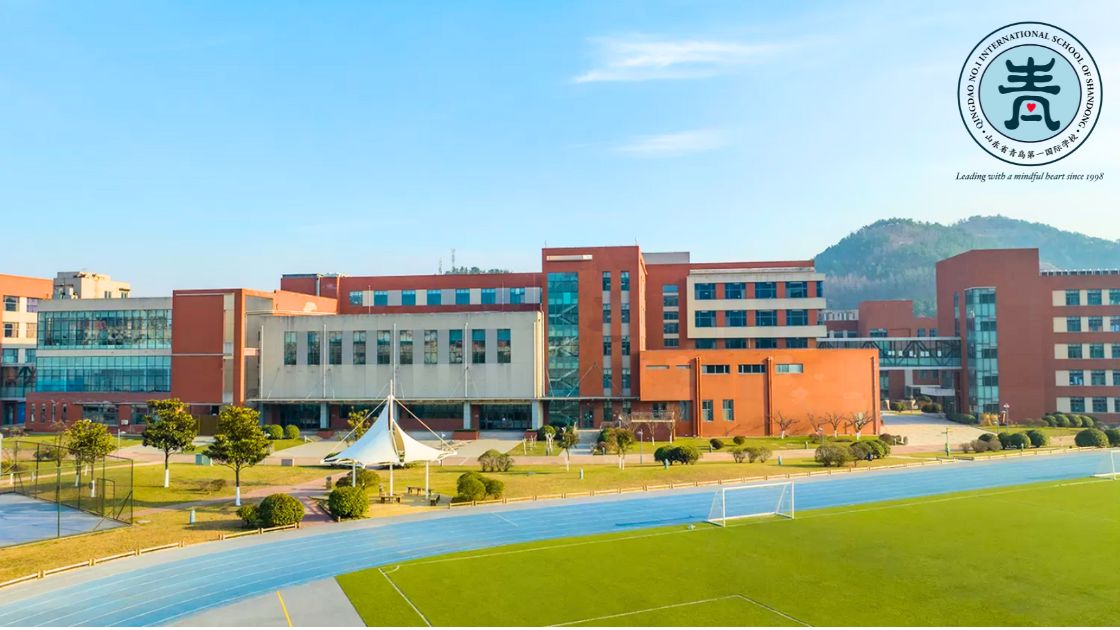 How To Choose an International School in China 1 Qingdao No. 1 International School of Shandong (QISS) campus in China with academic buildings, green lawns, and a running track in the foreground, overlaid with the text ‘How To Choose an International School in China