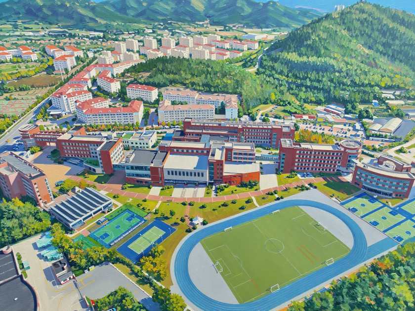 Living in Qingdao with Children: Education & Family Life Guide 1 Aerial view of QISS campus in Qingdao, highlighting modern buildings and facilities for families comparing schools in China.