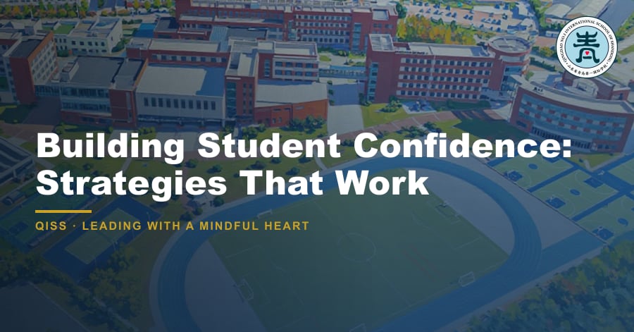 Building Student Confidence: Strategies That Work — featured image showing QISS Qingdao campus with title overlay and QISS school logo.
