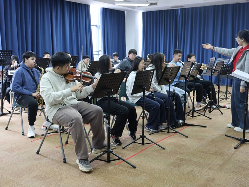 College Counseling in International Schools: A Parent Guide 3 Middle school students perform in a school orchestra rehearsal, illustrating the arts and extracurricular opportunities that support holistic student development