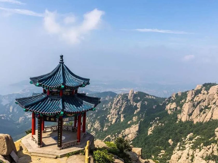 Gap Year Before University: Pros, Cons, and How to Decide 2 Traditional Chinese pavilion atop a dramatic mountain landscape symbolising cultural exploration and purposeful travel during a gap year