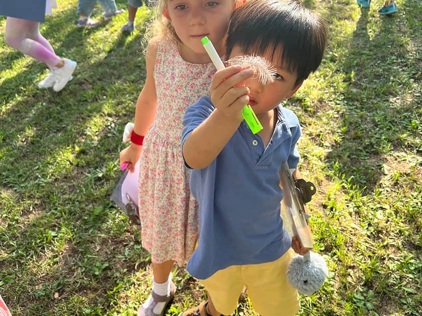 STEM in International Schools: A Guide for Parents 3 Young QISS students explore outdoors with observation tools during a nature-based STEM discovery activity on campus grounds.