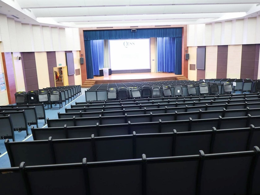 Student Council: Building Democratic Leadership Skills 3 The QISS auditorium with stage and projection screen where student council holds assemblies and school-wide presentations