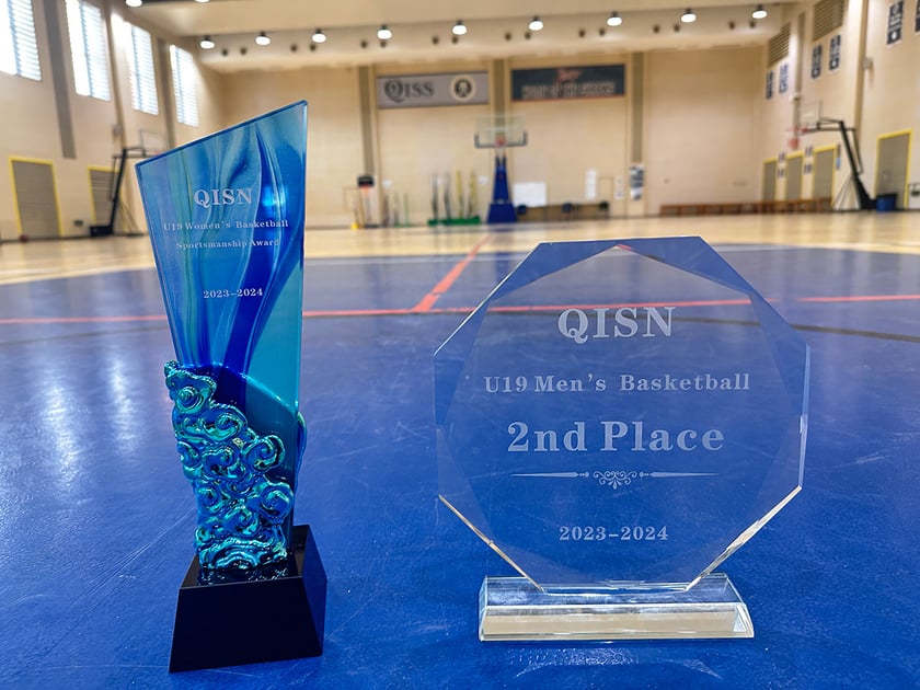 University Scholarships for International Students 2 QISS basketball sportsmanship and achievement trophies representing the awards students earn through early extracurricular commitment