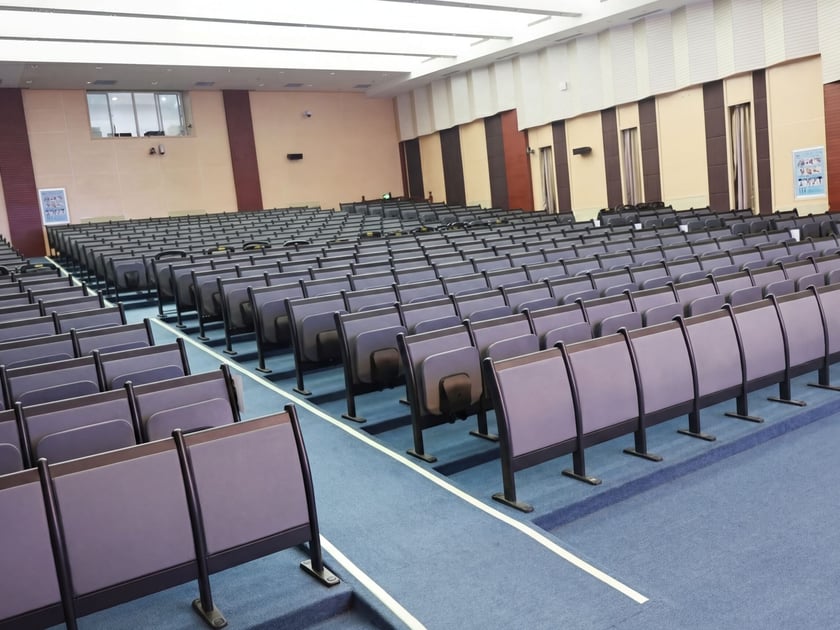 Child Safeguarding in Schools: A Parent's Guide 3 Spacious modern school auditorium with tiered seating where parent information sessions and safeguarding conversations take place