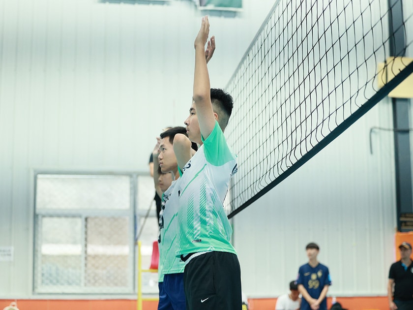 School Clubs and Activities: A Guide for Students 1 Middle school students in QISS Sharks uniforms competing in an indoor volleyball match, illustrating team-based after-school activities