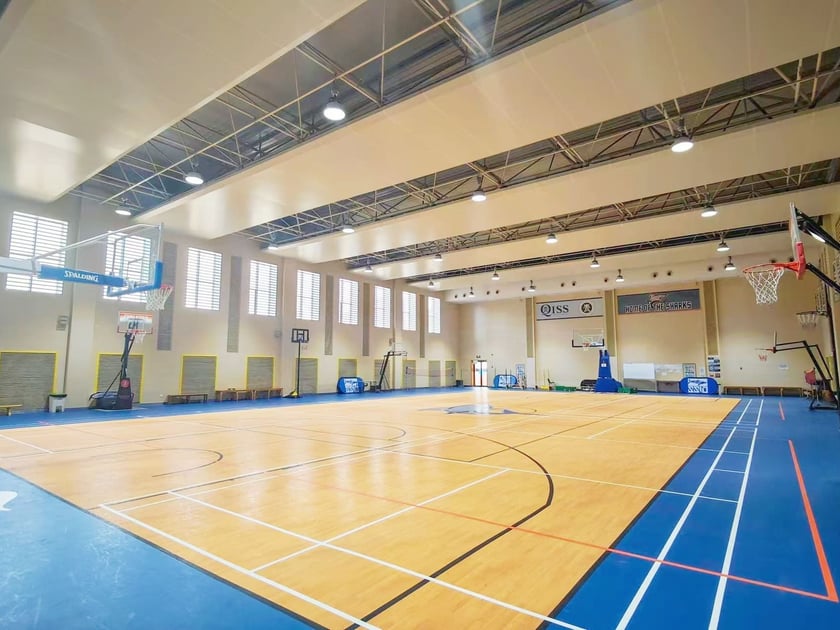 School Visit Tips: What to Look for on Campus 2 Bright modern school gymnasium with professional basketball courts and high-grade lighting at QISS