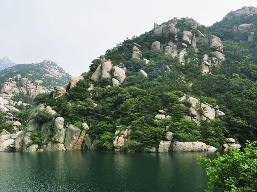 Living in Laoshan District, Qingdao: A Parent's Guide 1 Laoshan mountain hiking trail with granite rocks and lake views, Qingdao
