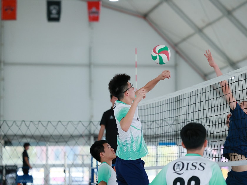 School Facilities: What Every Parent Should Evaluate 1 Middle school student spikes volleyball over net during indoor school gym match in team uniform