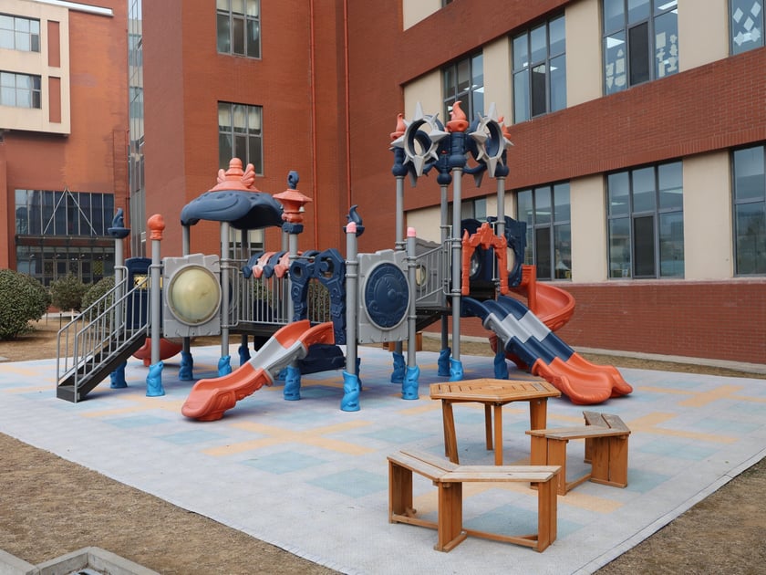 Outdoor Learning Spaces: How Schools Bring Nature In 1 Colorful outdoor playground with climbing structures in a school courtyard — outdoor learning spaces school