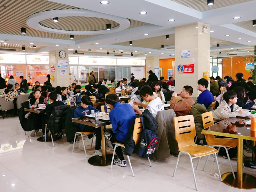 School Cafeteria Nutrition: What Parents Should Know 1 Students of all ages eating lunch together in QISS modern school cafeteria