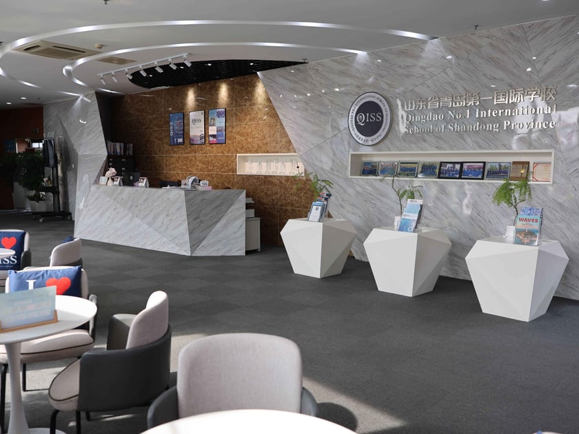 School Campus Safety: What Parents Should Know 2 Modern reception lobby at Qingdao No.1 International School with marble desk and school branding