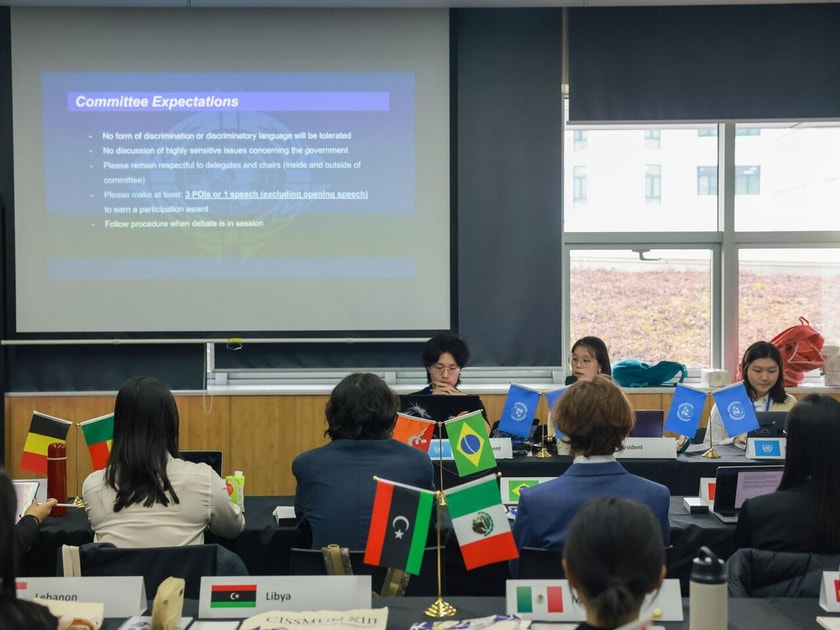 Choosing a University Major: A Parent's Guide 1 High school students at a formal committee table with projected 'Committee Expectations' slide during a Model UN session