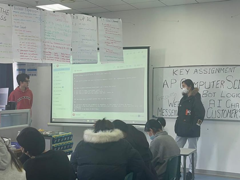 How to Send SAT Scores to Colleges: Score Choice Explained 2 Students present an AP Computer Science project to classmates in a QISS classroom